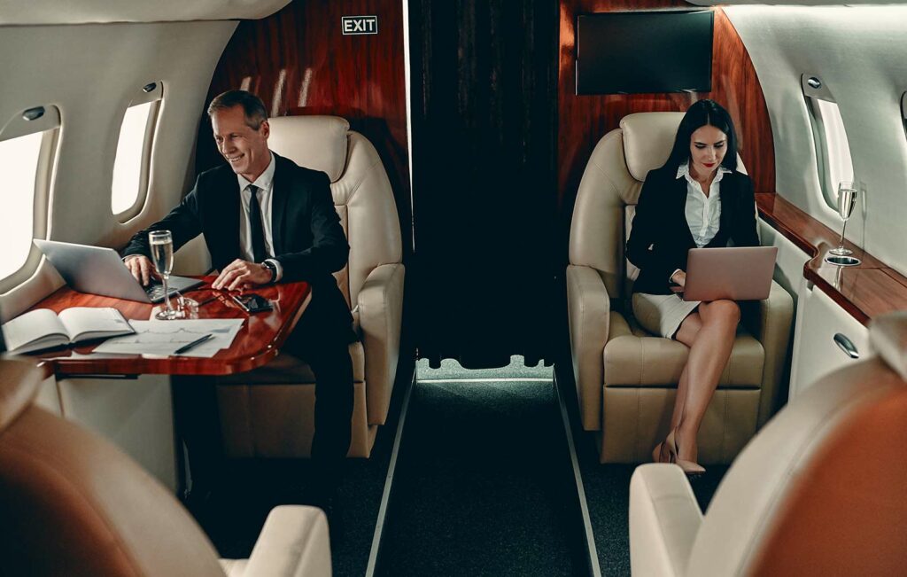 executive charter services man and woman sitting in private jet